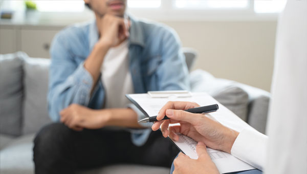 Therapist consulting with a patient